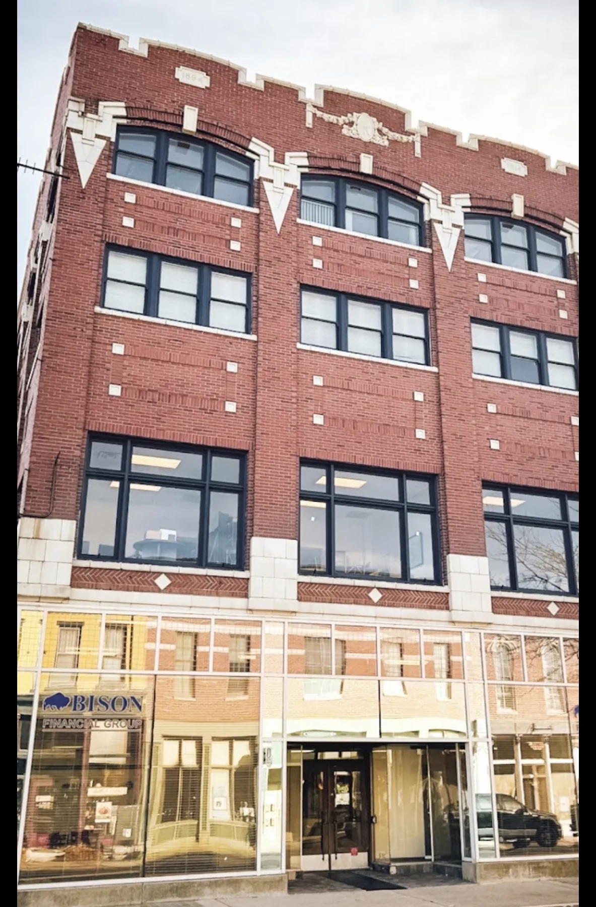 Jones & Sons commercial painting project on a brick building.